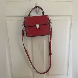 Red leather material bag.